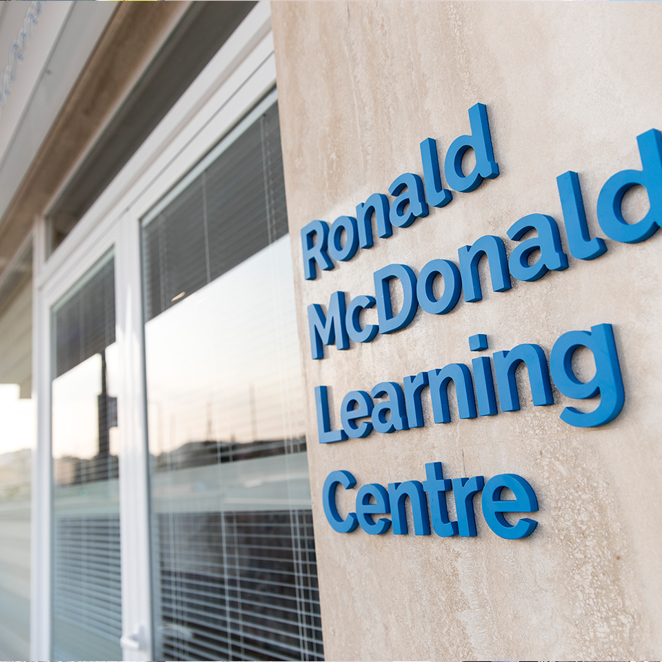Building exterior, windows, lettering in blue "Ronald McDonald Learning Centre"